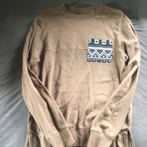 Beige with white speckles, decorative blue pocket